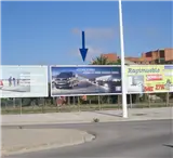 Valla publicitaria en la avenida de la Mallada esquina con la avenida del Racó de l'Horta, frente al parque comercial Vidanova Parc, Sagunto