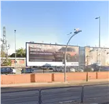 Valla publicitaria de 8 x 3 metros montada en el cierre del aparcamiento de ADIF, en la avenida de Lisboa, Alcorcón