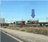 Valla publicitaria en la Ronda Nord de Xàtiva, entrada desde Gandía