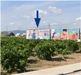 Valla publicitaria en el acceso a la ronda desde el puente, rotonda del British School Játiva