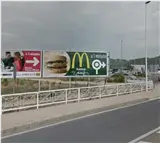 Valla publicitaria en la CV-41, rotonda de entrada a Xàtiva desde Alzira